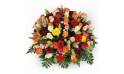 L'Agitateur Floral | image de la composition piquée de roses jaunes rouges et oranges
